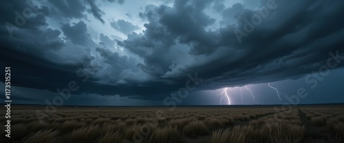Dramatic Stormy Sky with Lightning Over a Vast Open Plain and Wind-Swept Tall Grass