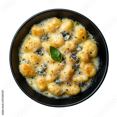 black plate of gnocchi gratinated with blue cheese on white background photo