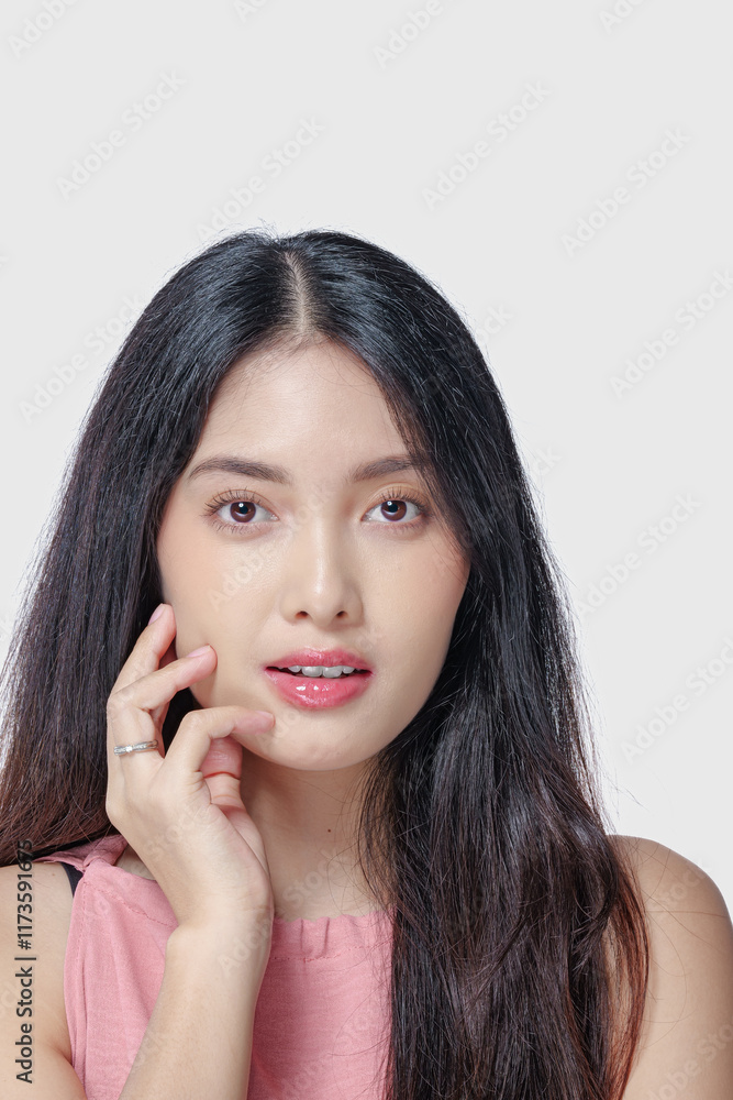 Elegant young Asian woman with beautiful make up doing a chic pose isolated by white background. Elegant young Asian woman with beautiful make up doing a chic pose isolated by white background.
