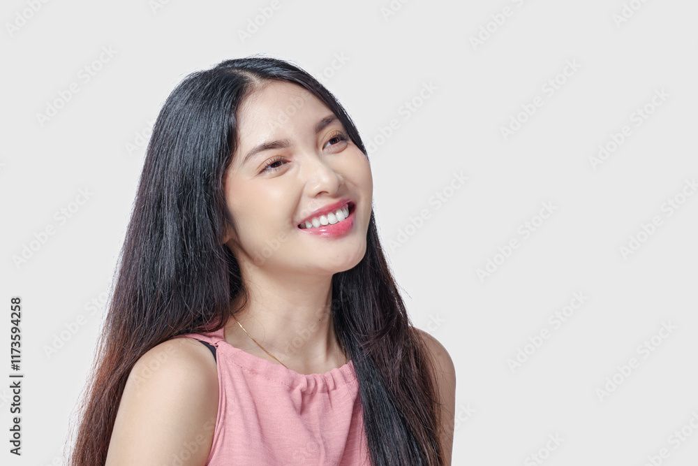 Excited young Asian woman wearing pink dress with a joyful expression, isolated by white background. Excited young Asian woman wearing pink dress with a joyful expression, isolated by white background.