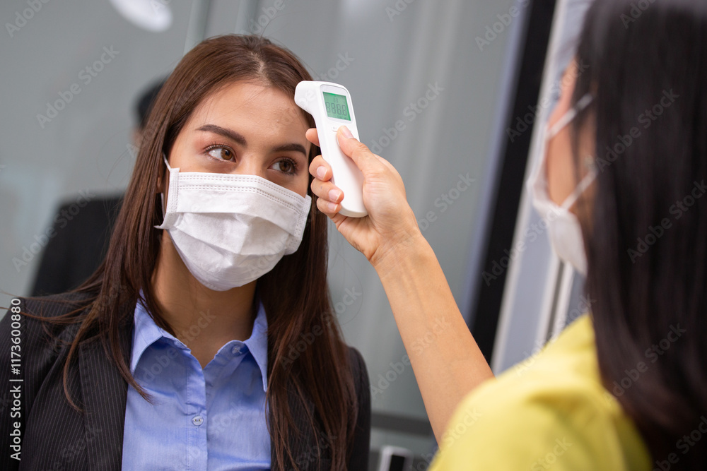 Poster Asian employee using infrared thermometer check fever ...