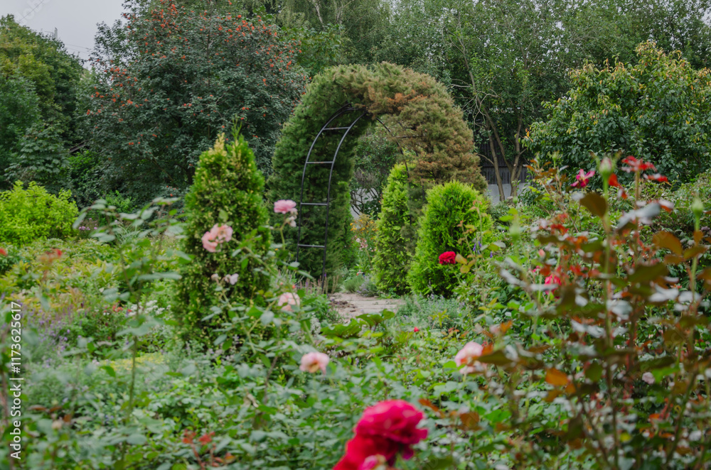flowering garden in greenery with arch of foliage, garden design flowering garden in greenery with arch of foliage, garden design