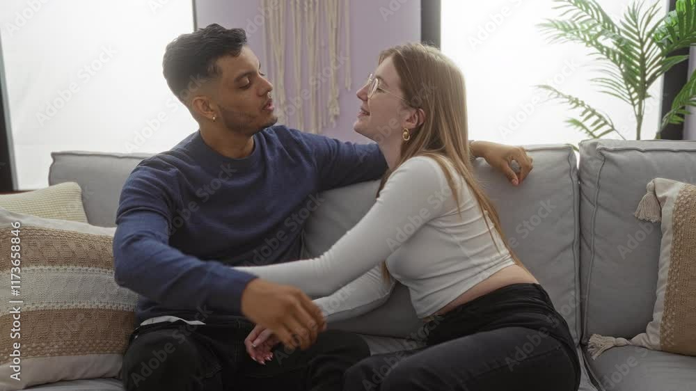 Couple embraces affectionately on sofa in cozy living room setting depicting love happiness and intimacy with modern decor Couple embraces affectionately on sofa in cozy living room setting depicting love happiness and intimacy with modern decor