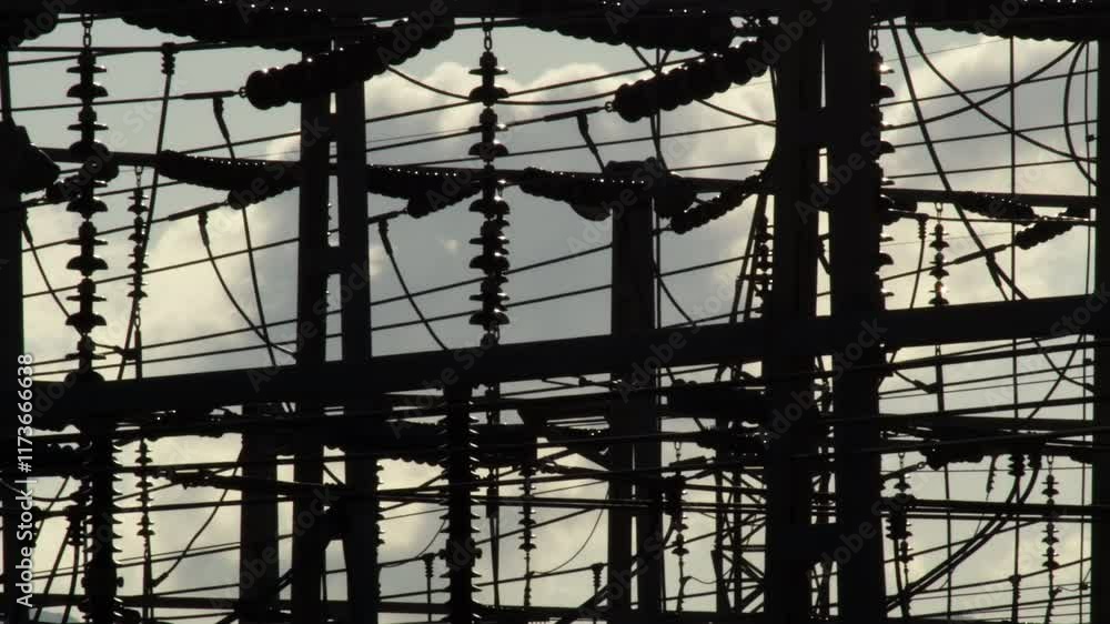 Power lines at a power station with clouds passing in the background. Time Lapse Power lines at a power station with clouds passing in the background. Time Lapse