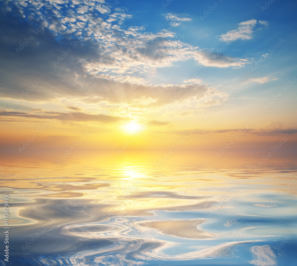 Obraz premium Nature background of colorful dramatic majestic sky clouds and sea waves during sunset.