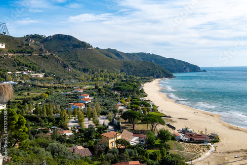Fototapeta Naklejka Na Ścianę i Meble -  Sandy beach of medieval small touristic coastal town Sperlonga and sea shore, Latina, Italy