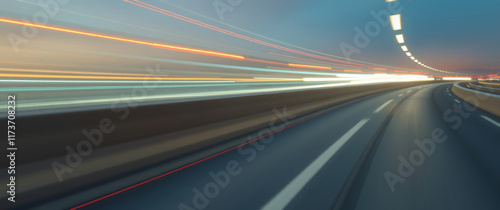 Driving fast on a highway at dusk with light trails