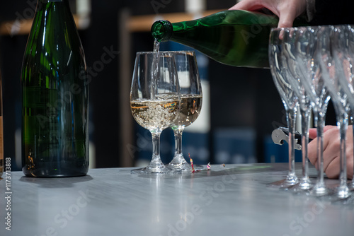 Tasting sparkling white wine, traditional champagne method making of cremant in caves on Moselle river valley in Luxembourg, wine tour and visiting caves photo