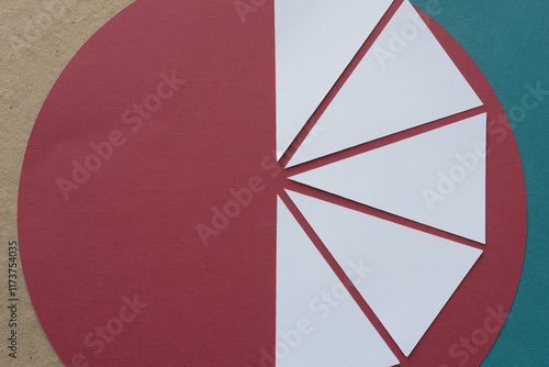 white paper isosceles triangles arranged on red and green geometric forms  photo