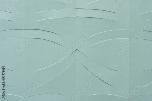 green paper background with roughly incised lines photo