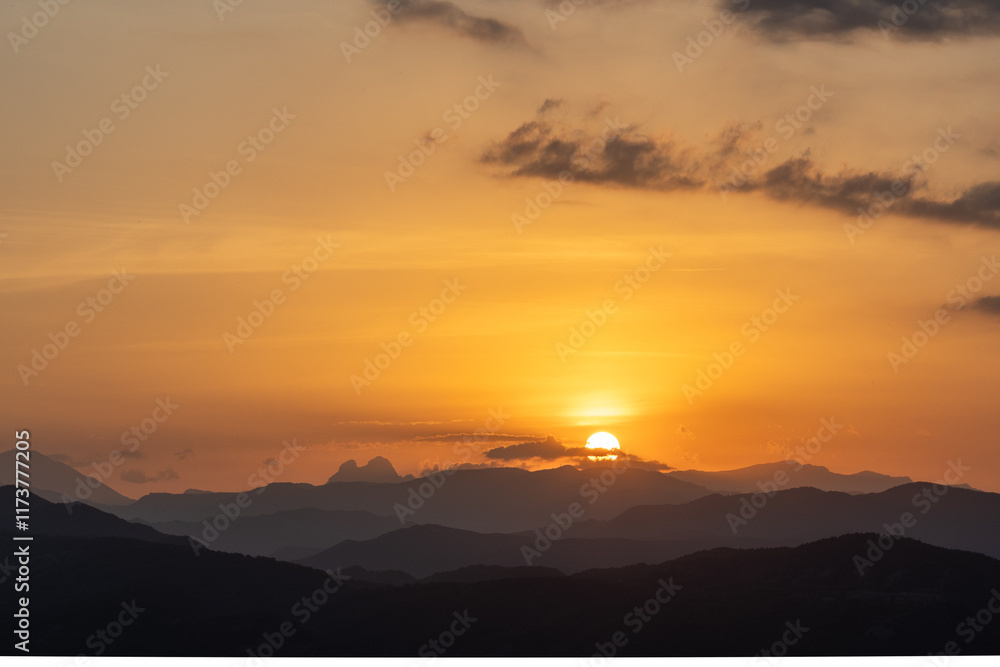Orange sunset with the silhouette of the mountains