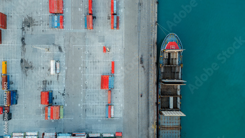 Aerial photography of containers for maritime transport of goods. Cargo ship in the port. Importation of products. Logistics park.