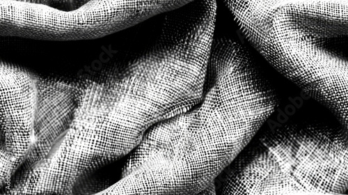 Close-up view of a natural fabric texture highlighting its complex pattern and weave. The image captures the subtle nuances of light and shadow within the fibers photo