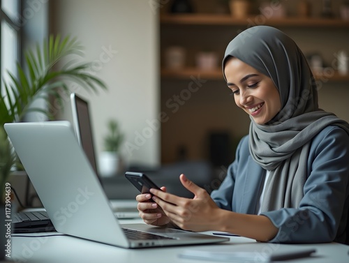 Wallpaper Mural Muslim woman in hijab islamic girl Arabian businesswoman entrepreneur calm smiling business lady working at desk scrolling mobile phone gadget addicted female online app cellphone internet in office Torontodigital.ca