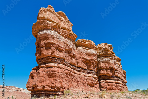 A large sandstone rock formation along Notom Road Scenic Backway near Capitol Reef National Park in Utah, USA photo