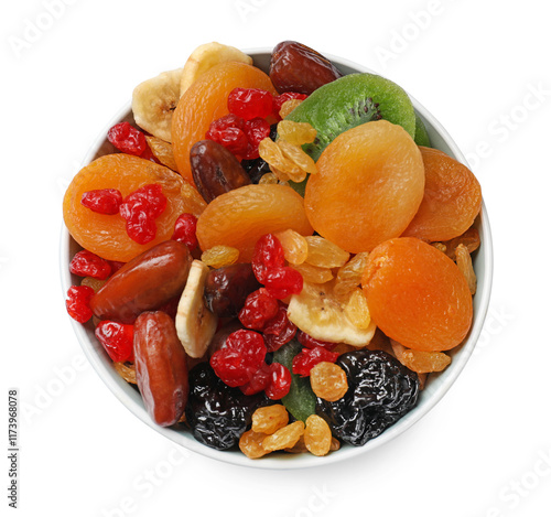 Mix of different dried fruits in bowl isolated on white, top view photo