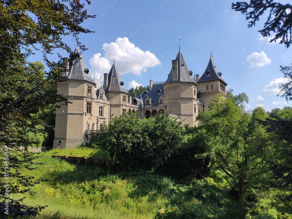 Photo showing the castle in Gołuchów in Poland at sunset, in summer, surrounded by a park.
Photo showing the castle in Gołuchów in Poland at sunset, in summer, surrounded by a park.