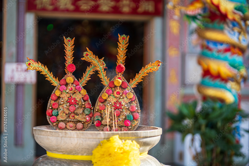 Red candles and burning incense sticks Paper gold with the Chinese alphabet Blessings written on it Is a Fortune blessing compliment for pay respect to god in Chinese New Year day at a Chinese shrine