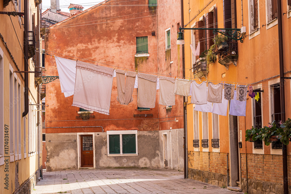 Italy, Venice. Arsenale neighborhood, Castello district. Laundry hanging to dry between buildings.