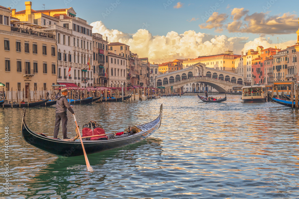 Italy, Venice. Rialto Bridge, the oldest bridge on the Grand Canal. Gondola in foreground. Italy, Venice. Rialto Bridge, the oldest bridge on the Grand Canal. Gondola in foreground.