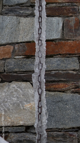 Chain Frozen In Ice With A Brick Texture Background
