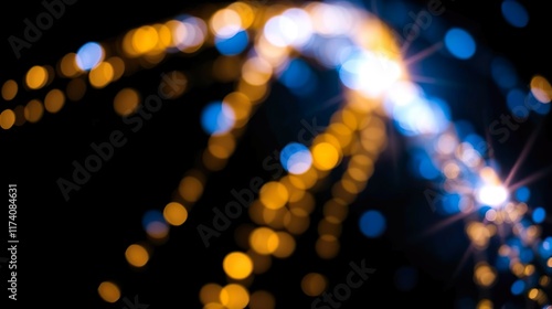 Wallpaper Mural abstract background featuring glittering lights in vibrant blue and gold shades, scattered against a dark black gradient. Torontodigital.ca