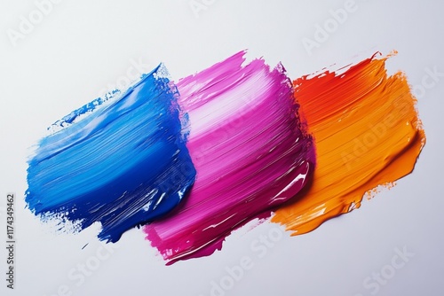 Abstract brushstrokes of vibrant blue and pink paint on a white background photo