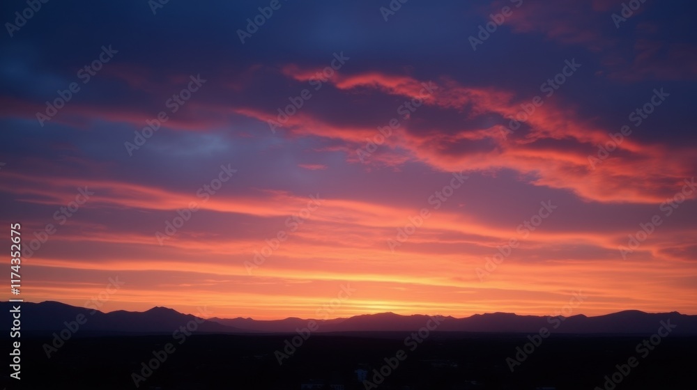 Fototapeta premium Majestic Sunset Over Mountains with Vibrant Sky and Cloud Patterns