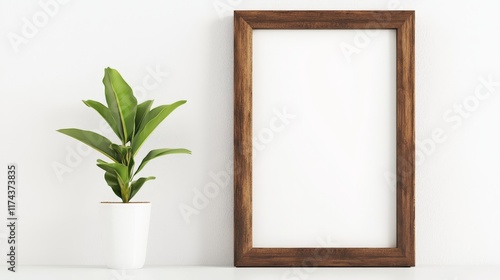 a simple elegant wooden picture frame sits on a white shelf - mockup template