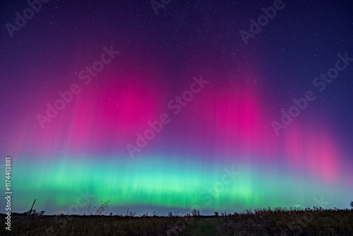 Northern Lights display  in an open grass field