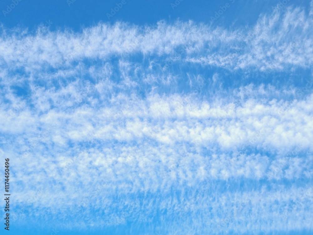 Obraz premium Beautiful view of fluffy white clouds in the blue sky. Natural background