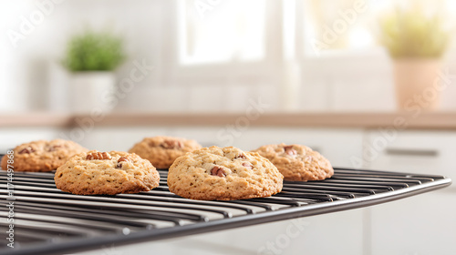 Freshly baked oatmeal pecan Amish Bridesman cookies cooling on an oven rack, showcasing a warm and rustic homemade dessert in a cozy kitchen setting.
 photo