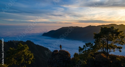 silhouette of a person in the mountains
