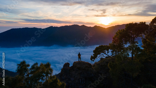 silhouette of a person in the mountains