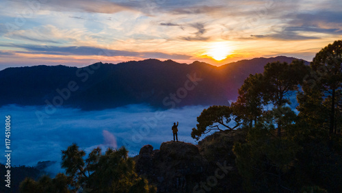 silhouette of a person in the mountains