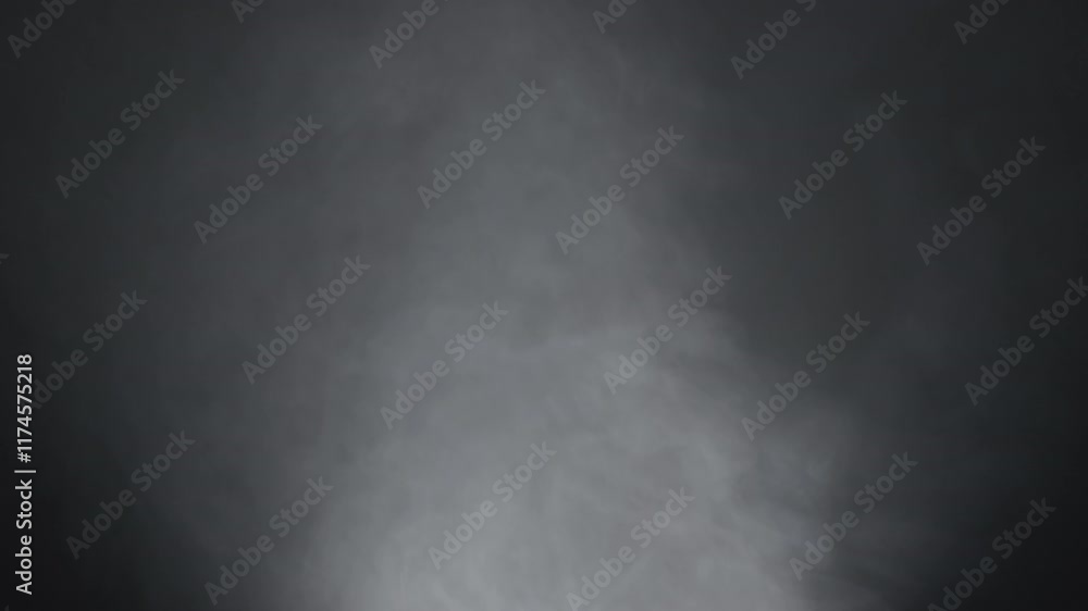 Mysterious Dark Gray Smoke Swirling Against a Black Background Mysterious Dark Gray Smoke Swirling Against a Black Background