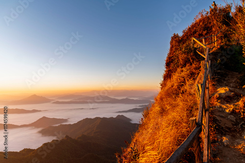 Obraz na płótnie Landscape and sun rise of the mountain and sea of mist in winter sunrise view from top of Phu Chi Dao mountain , Chiang Rai, Thailand w salonie