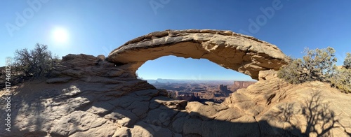 A stunning view of the beautiful arches, a unique rock formation that forms natural arches and windows overlooking vast desert landscapes photo