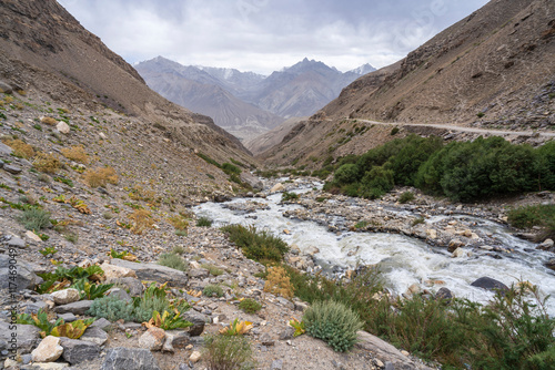 Scenic landscape view with mountain torrent of Wakhan range in Afghanistan from high altitude desert in Gorno-Badakhshan, Tajikistan Pamir photo