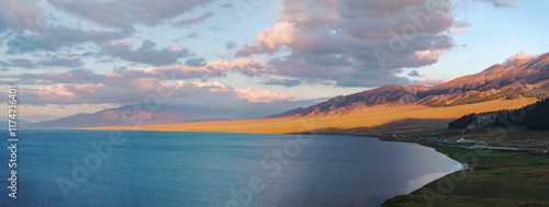 The beautiful scenery of Sayram Lake, coastal mountains, and grasslands in Xinjiang, China on September 4, 2024 photo