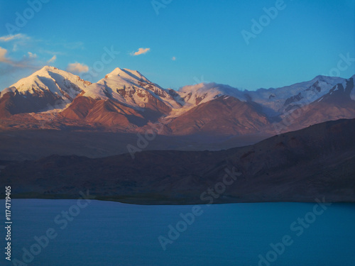 The beautiful scenery of Baisha Lake and Mustag Snow Mountain in the Pamir Plateau of Xinjiang, China on September 4, 2024 photo