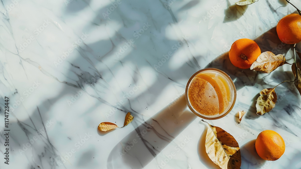 Glass of freshly squeezed orange juice on a marble countertop with fresh oranges and green leaves, highlighting vibrant health and freshness. Glass of freshly squeezed orange juice on a marble countertop with fresh oranges and green leaves, highlighting vibrant health and freshness.