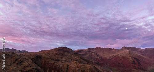 Beautiful aerial drone landscape image of Blea Tarn and Langdale Valley in Lake District during vibrant Autumn sunrise photo