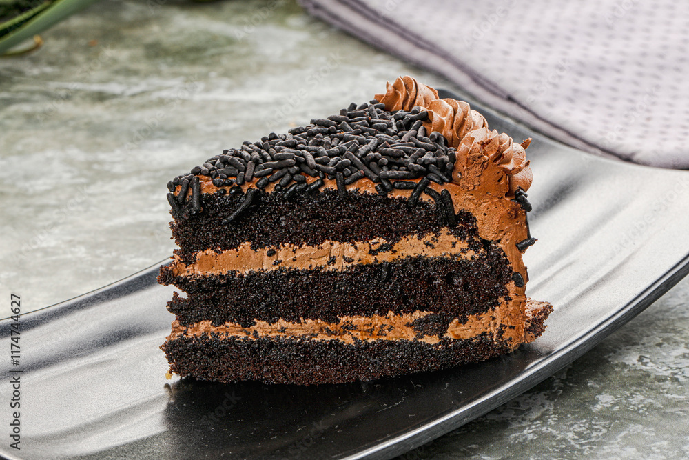 Fotografie Chocolate cake piece with cream