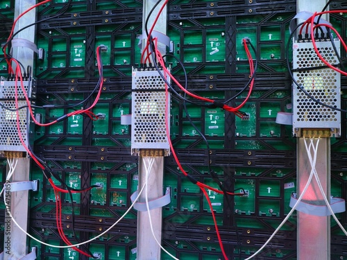 LED panel back shows complex wiring and electronic components. Organized LED panel back reveals underlying electronic technology.Technical view of LED panel back with intricate circuit connections. photo