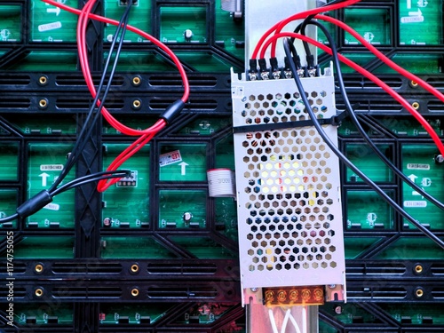 LED panel back shows complex wiring and electronic components. Organized LED panel back reveals underlying electronic technology.Technical view of LED panel back with intricate circuit connections. photo