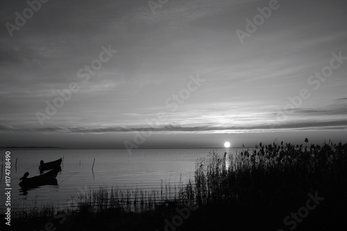Winter morning on the Razim saltwater lake in the traditional fishing village of Sarichioi, one of the largest lakes in Romania, part of the Danube Delta Biosphere Reserve, Tulcea County, Romania