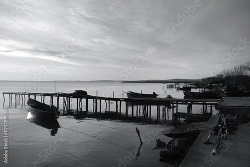 Winter morning on the Razim saltwater lake in the traditional fishing village of Sarichioi, one of the largest lakes in Romania, part of the Danube Delta Biosphere Reserve, Tulcea County, Romania photo