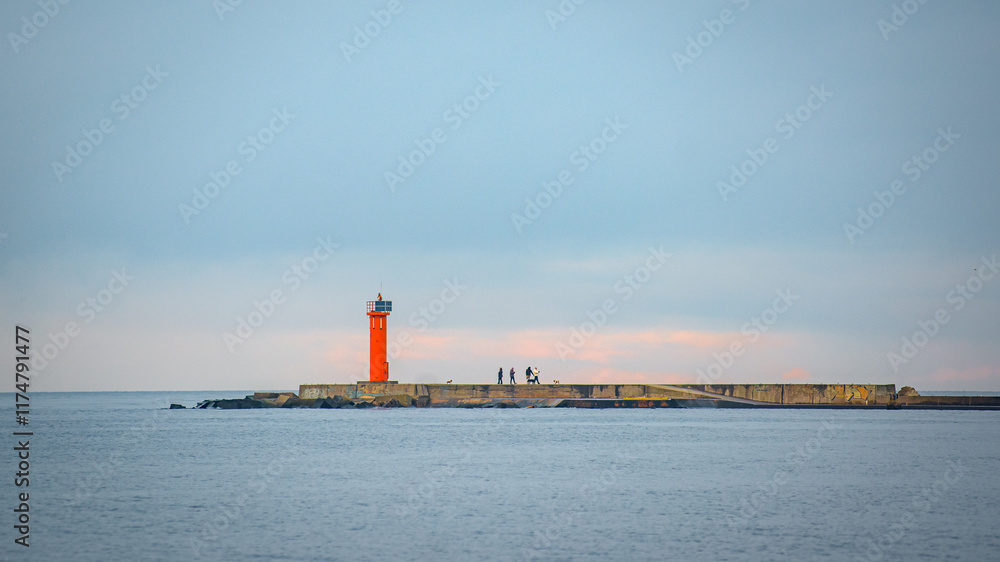 lighthouse at the end of breakwaters in the port lighthouse at the end of breakwaters in the port