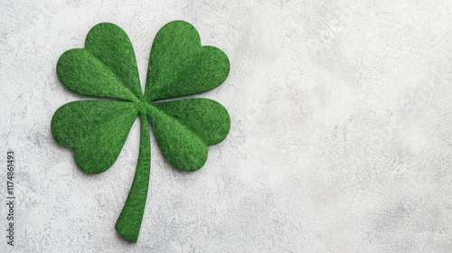 Green Felt Shamrock Symbol on Textured Gray Background